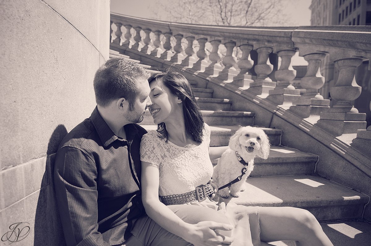 young couple kissing on stairs, couple sharing a moment on stairs of capital building, capital building albany engagement photos, albany engagement photographers, engagement session in capital building albany