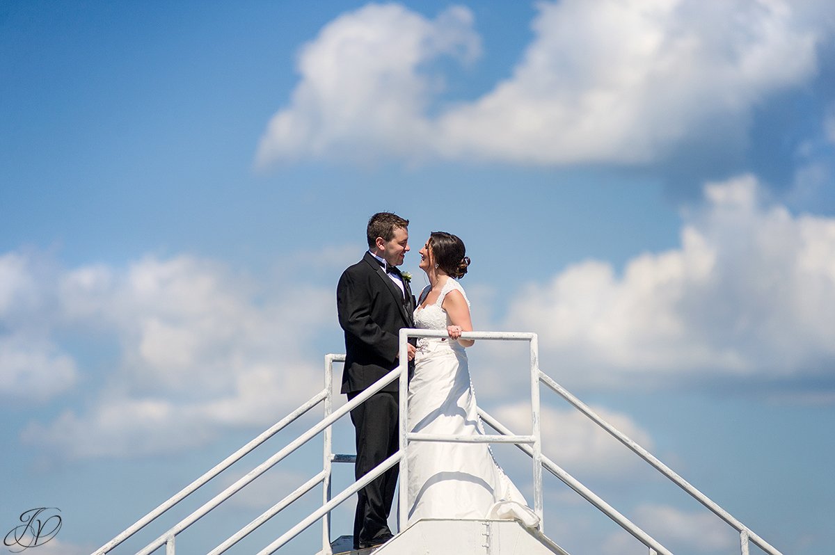 bride and groom with view of sky