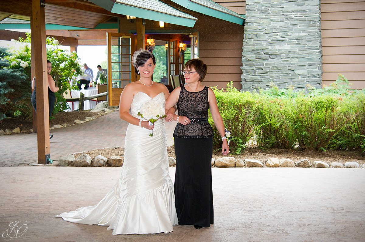 mom walking bride down aisle