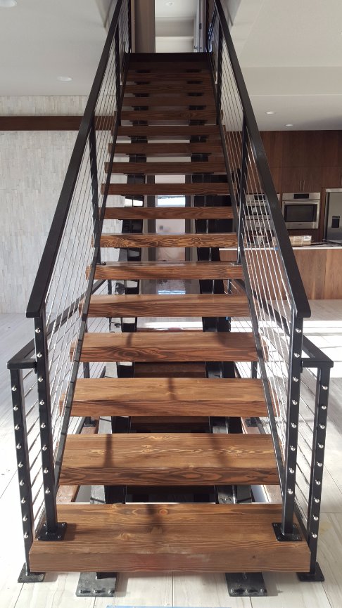 VS Fab Works designed and fabricated stair system with I-beam stringers and laminated beam treads