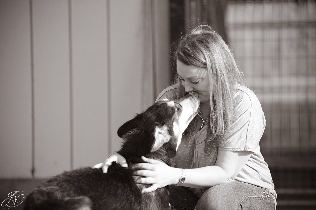 photo of happy rescue dog kissing rescuer