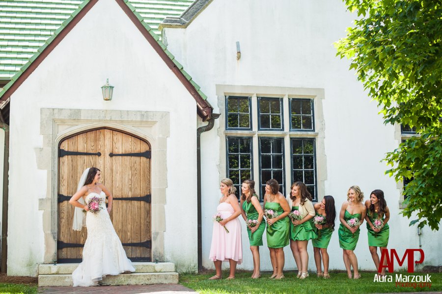 Bride gets sassy with her bridesmaids in Winston Salem, North Carolina. © Aura Marzouk Photography