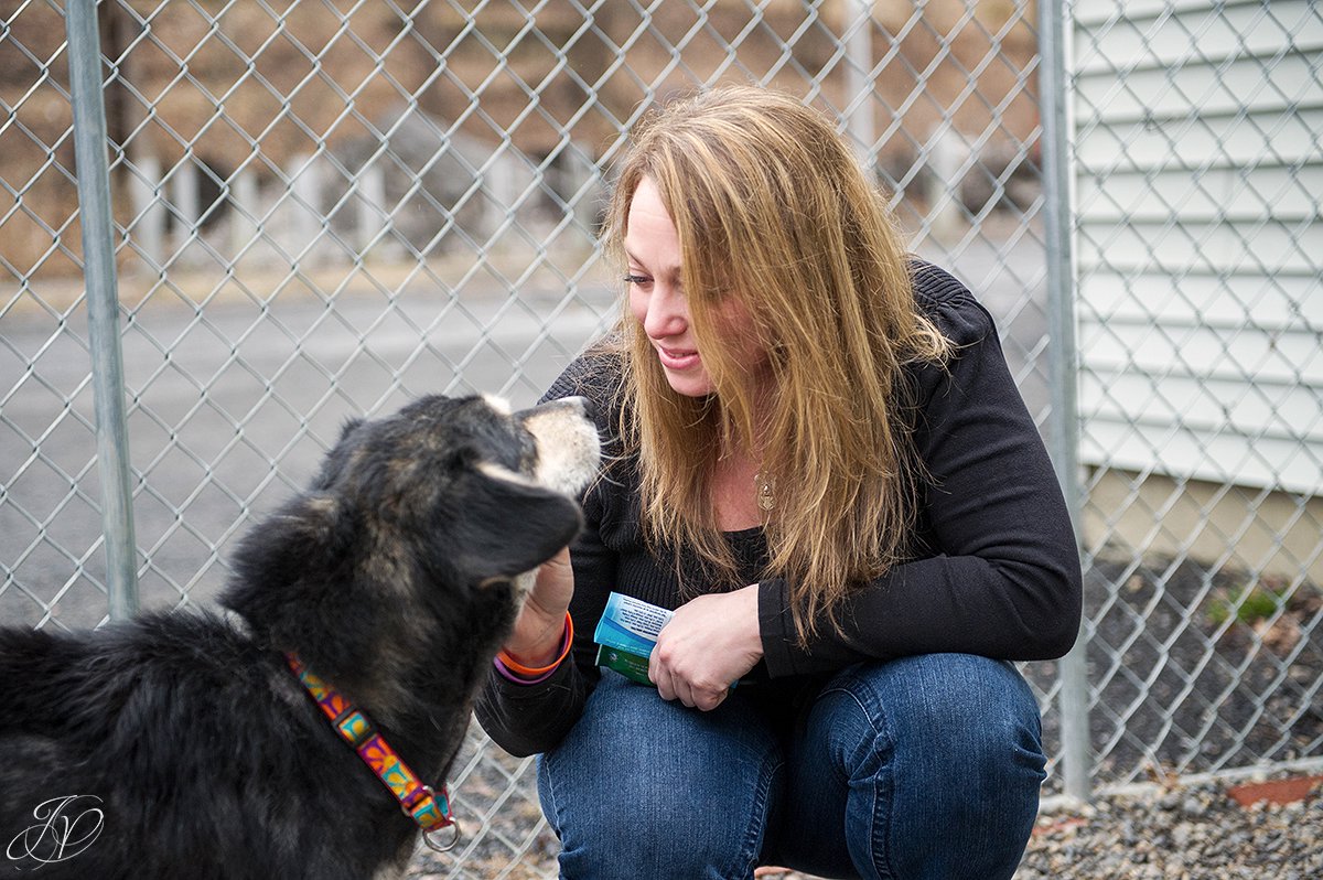 woman with rescued dog photo, regional animal shelter, dog rescue photo, rescued dog photo, canine skin disease photo