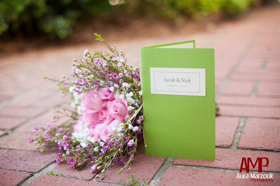 Pink and green wedding are brought together with pink rose bouquet and green wedding programs. Winston Salem Photography by Aura Marzouk Photography