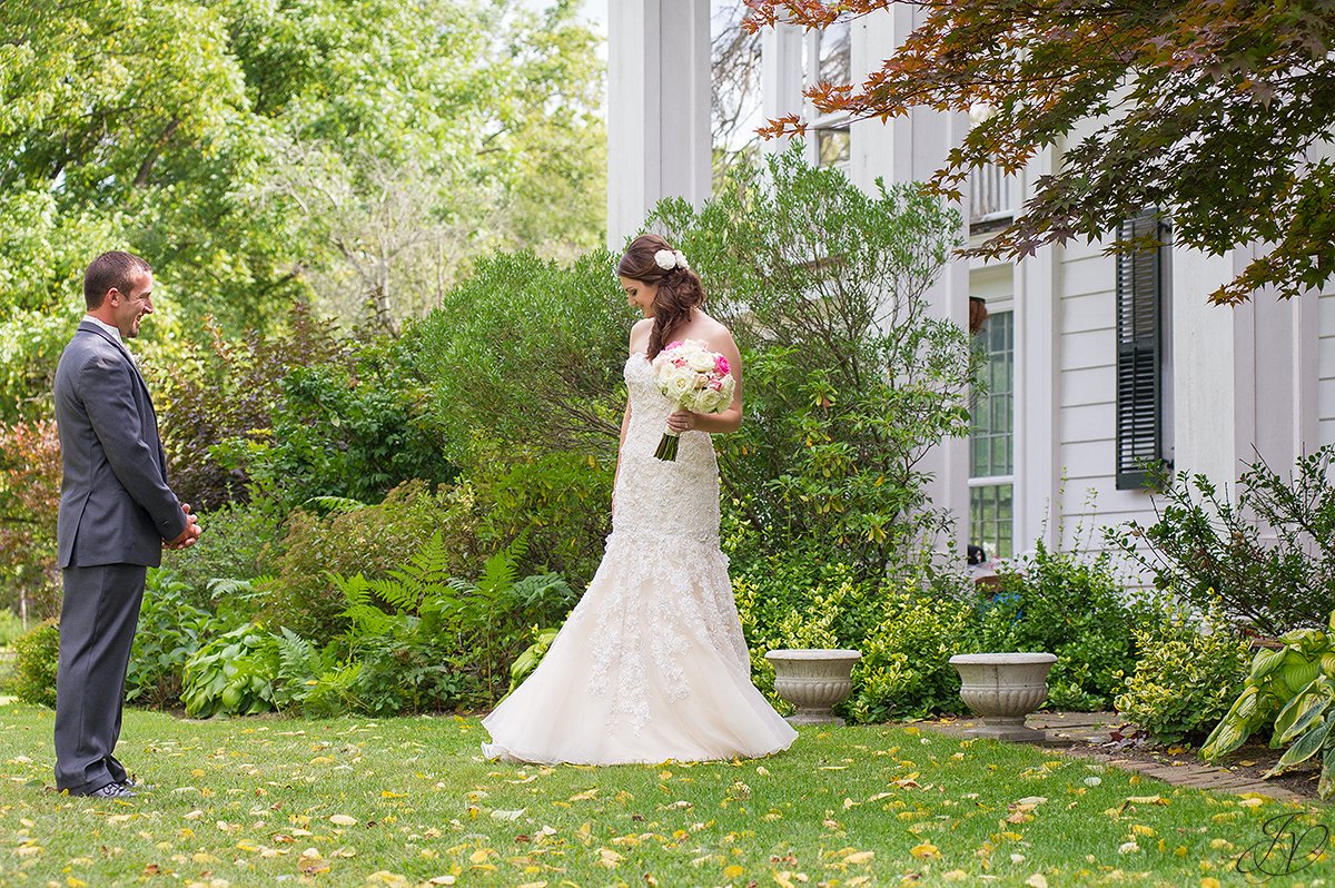 groom adores his bride during first look