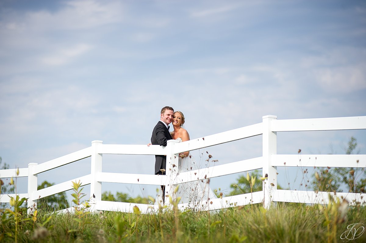 bride and groom white fence saratoga national