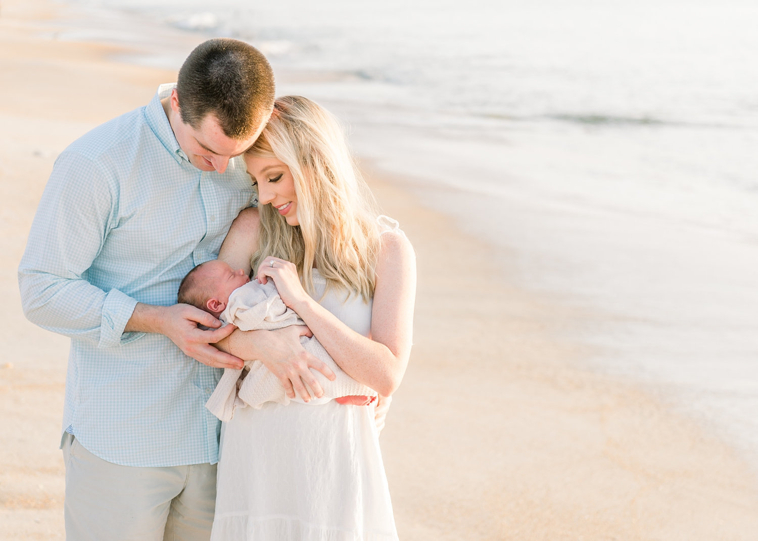 mom, dad, and newborn son, sunrise at Ponte Vedra Beach, Florida