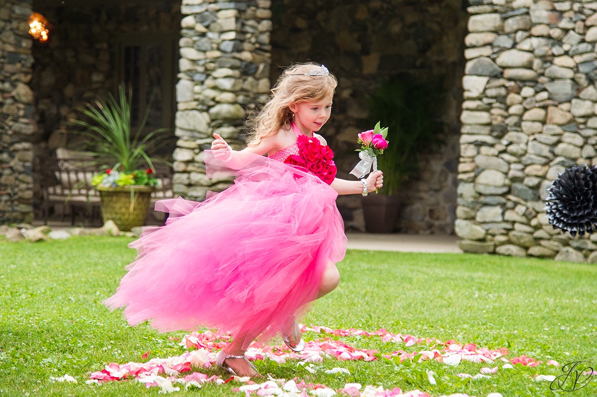 adorable flower girl coming down the aisle