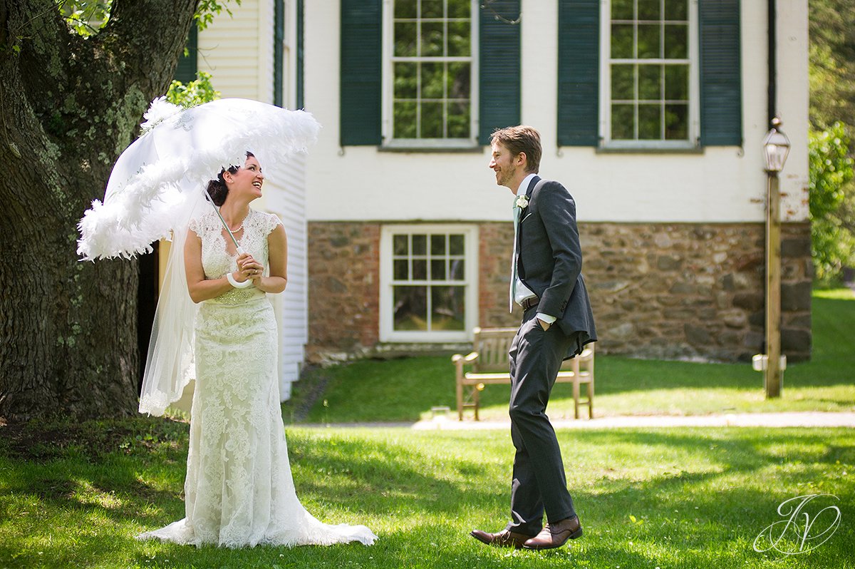 candid bride with umbrella, handsome groom with bride candid, Albany Wedding Photography, pruyn house wedding, Wedding at The Pruyn House