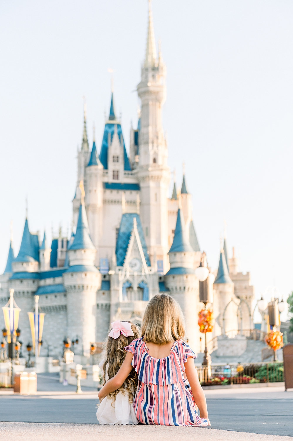 sisters looking at Cinderella Castle, Magic Kingdom, Fantasyland