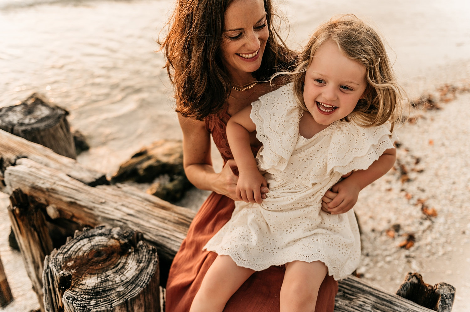 mother tickling daughter, brunette mom holding blonde little girl, Rya Duncklee