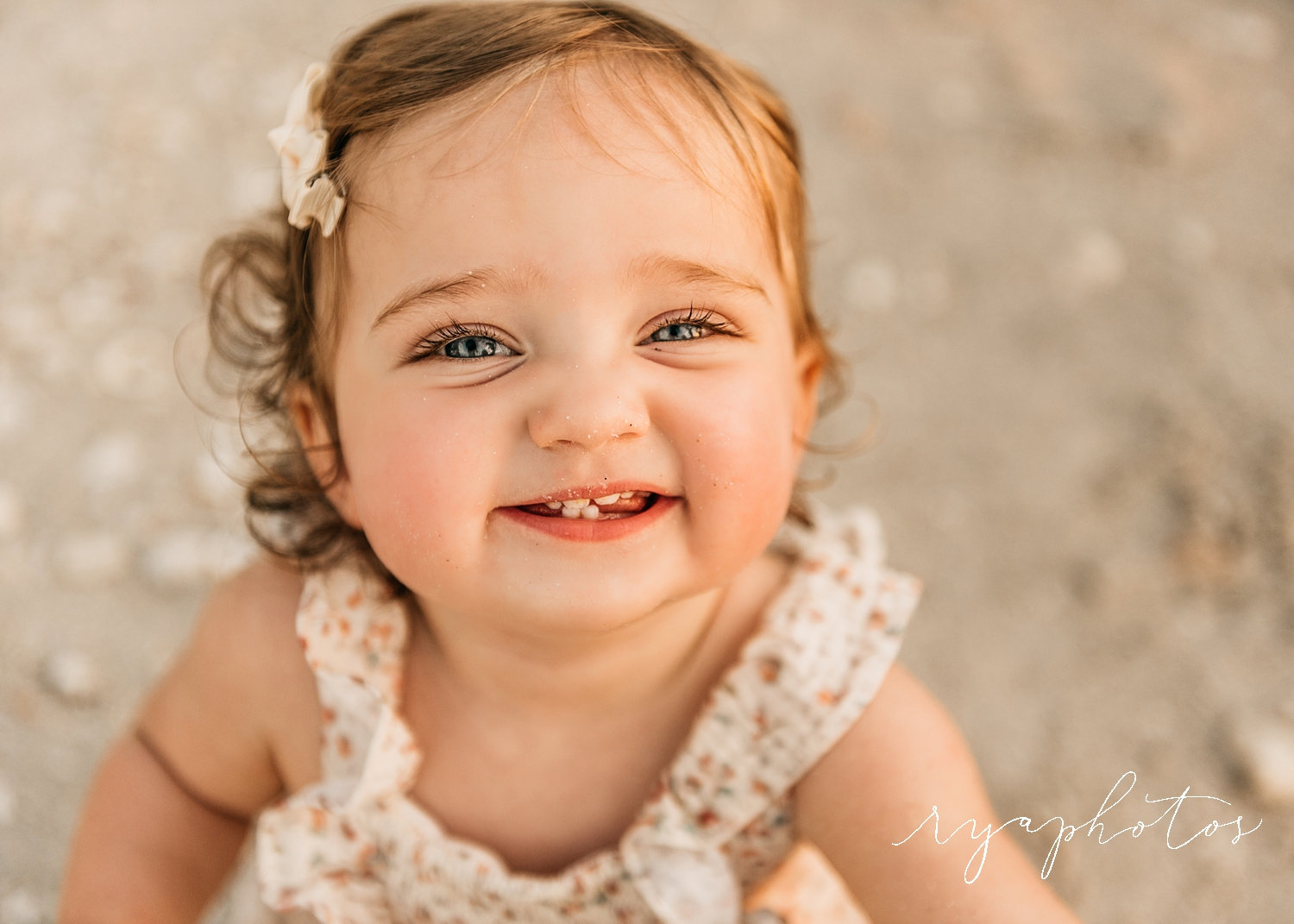 beautiful baby girl with curly hair and blue eyes, smiling baby girl, Ryaphotos