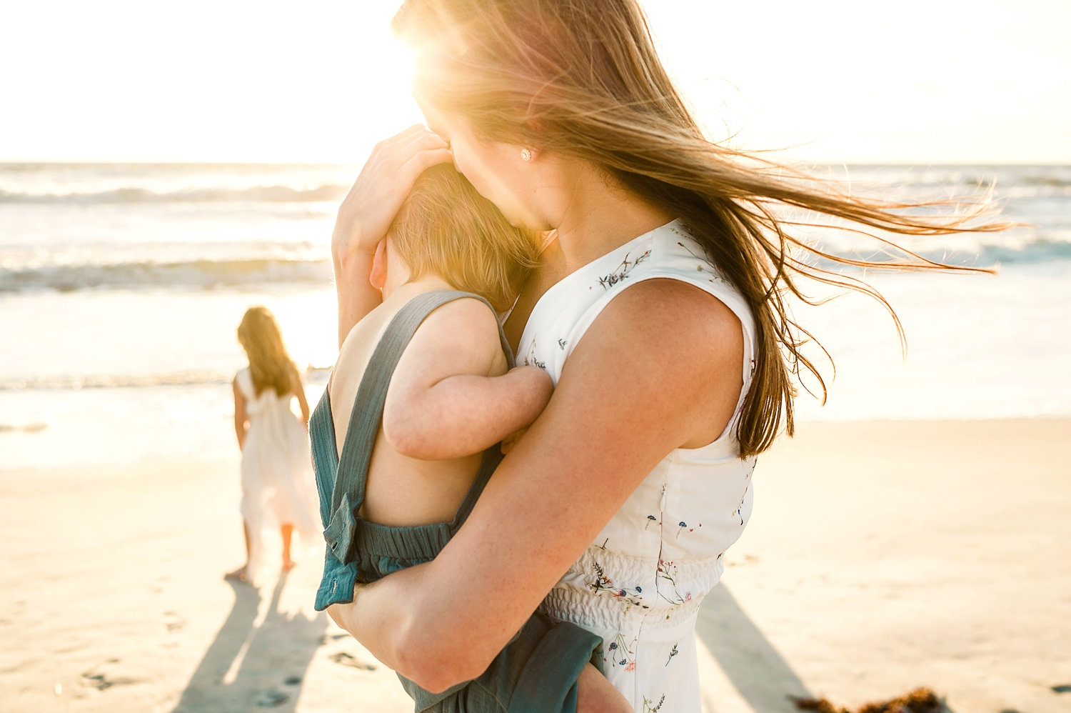 Florida beach, coastal sun flare, mother holding baby boy, denim bloomers, Rya Duncklee