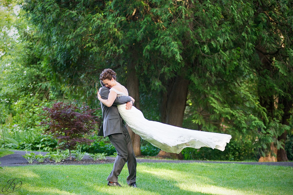 fun photo of groom twirling bride