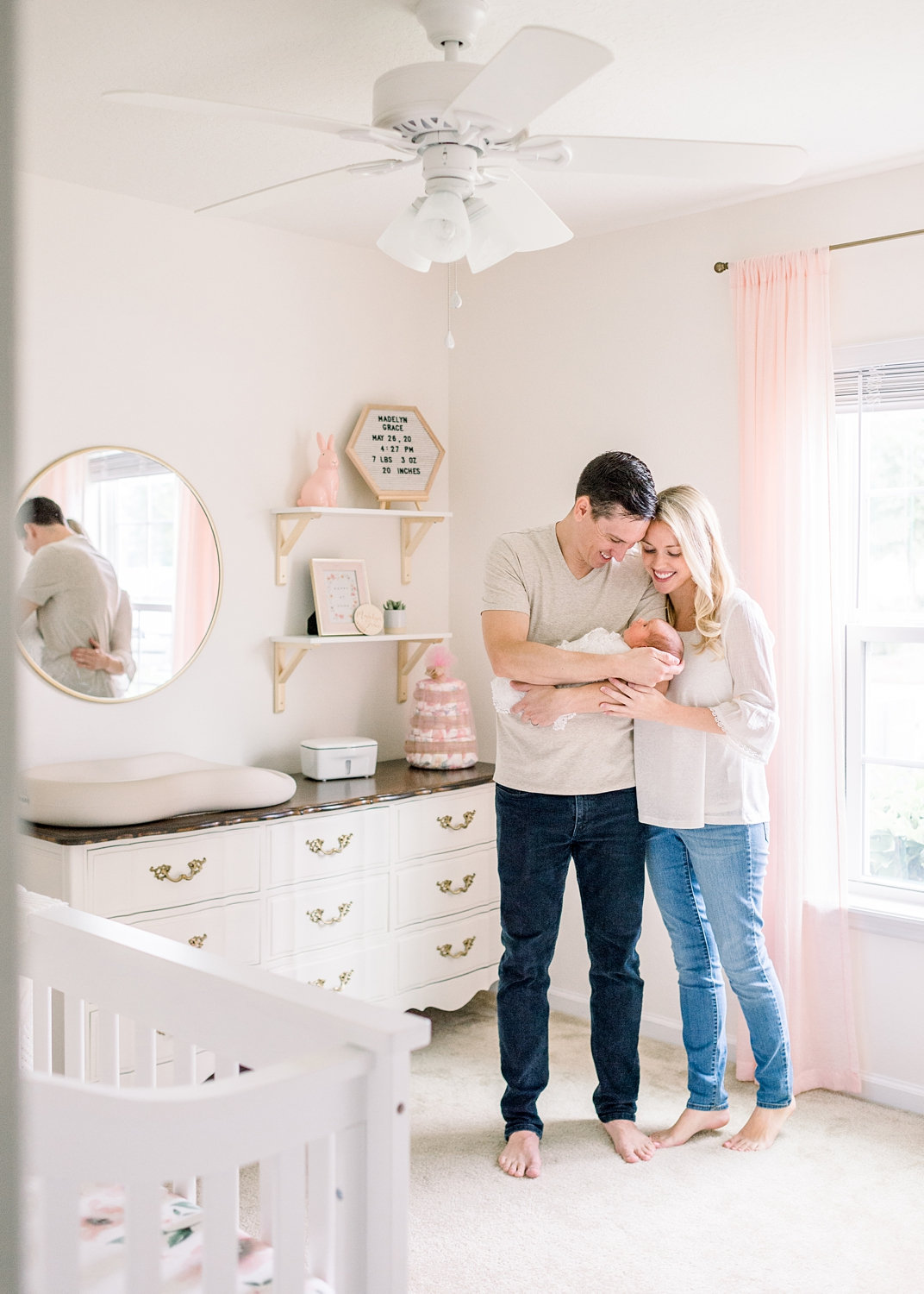 mom and dad with baby girl in nursery, girls nursery inspiration, Rya Duncklee