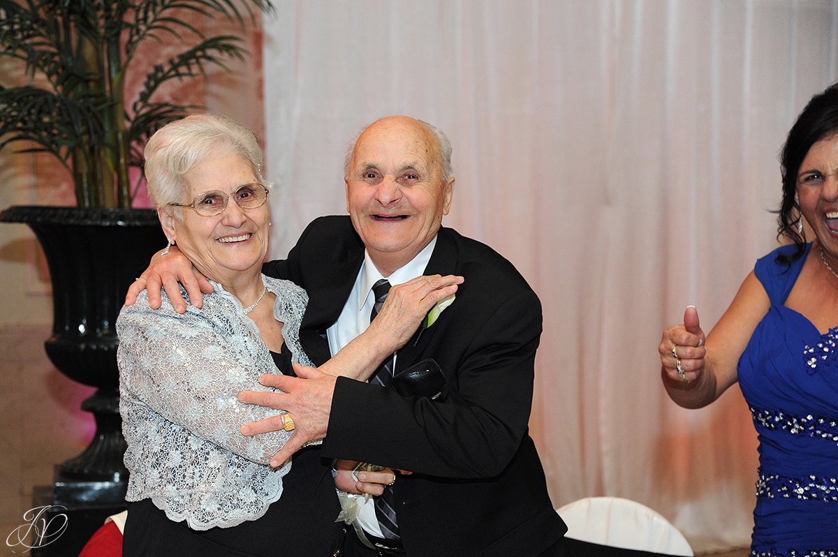 grandparents having fun at a wedding reception