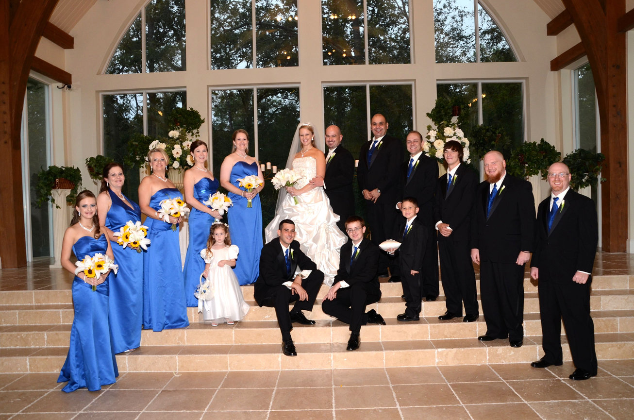 Bride, groom and bridal party posing