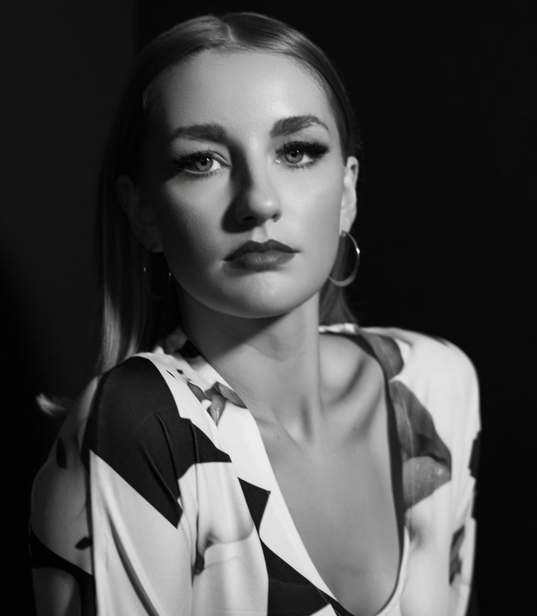 black and white portrait Film Noir studio portrait in Charleston, SC image is created by Heather Johnson Photography
