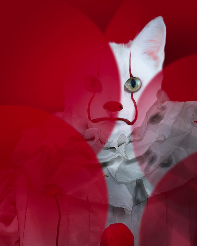Composite image of a cat dressed like It, behind red balloons.