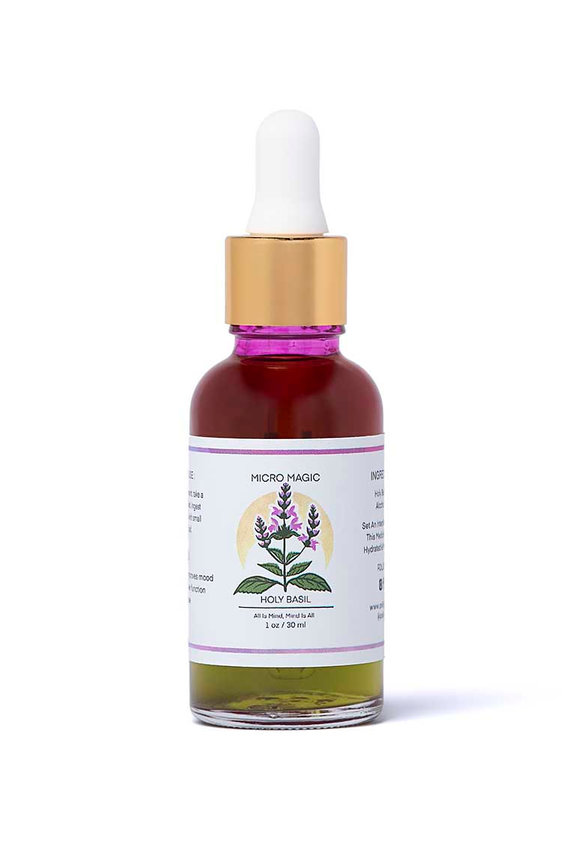 Purple and green dropper bottle of mushroom tincture on white background
