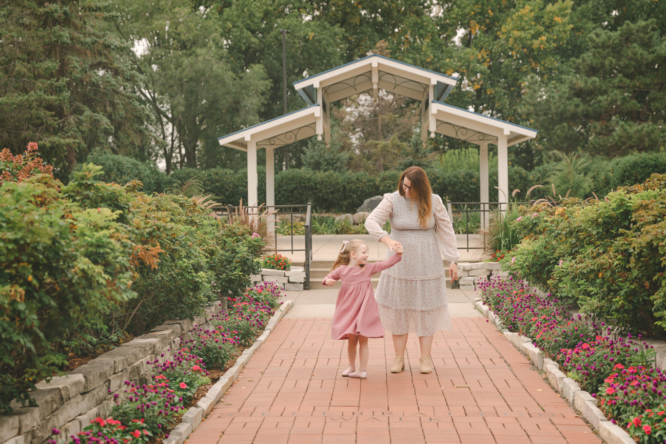 Mother and daughter dance outside in Roseville, MN
