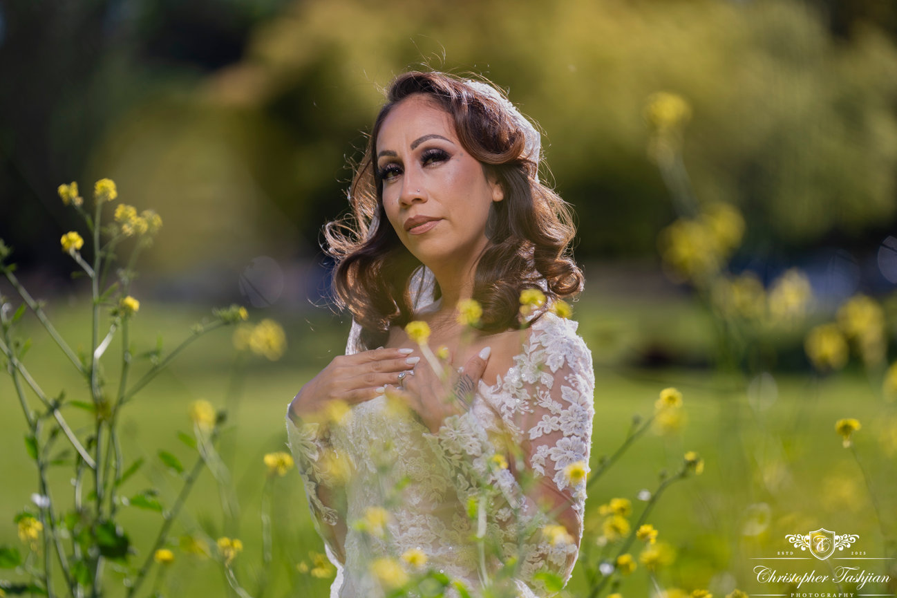 Bride standing in a field of wildflowers