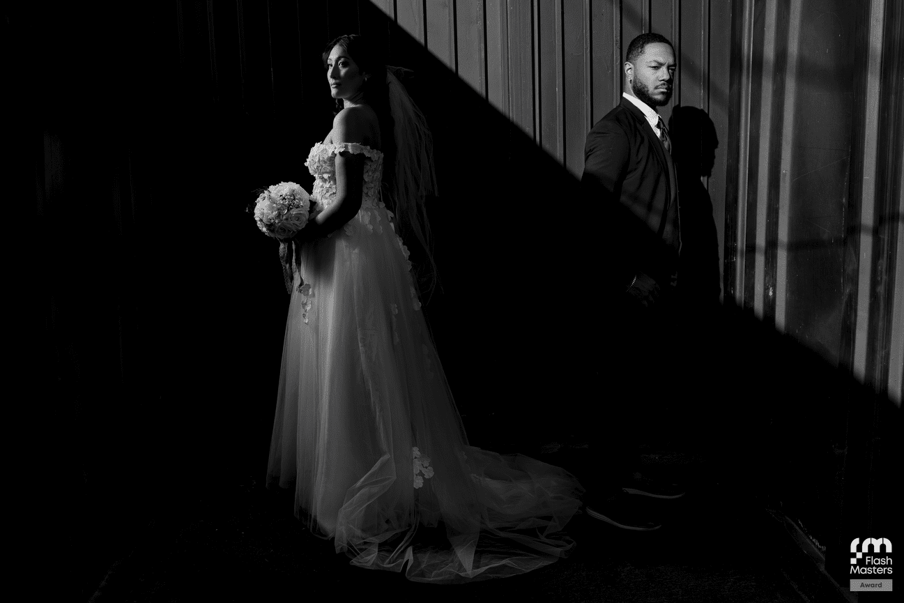 Black and white silhouette of a bride and groom