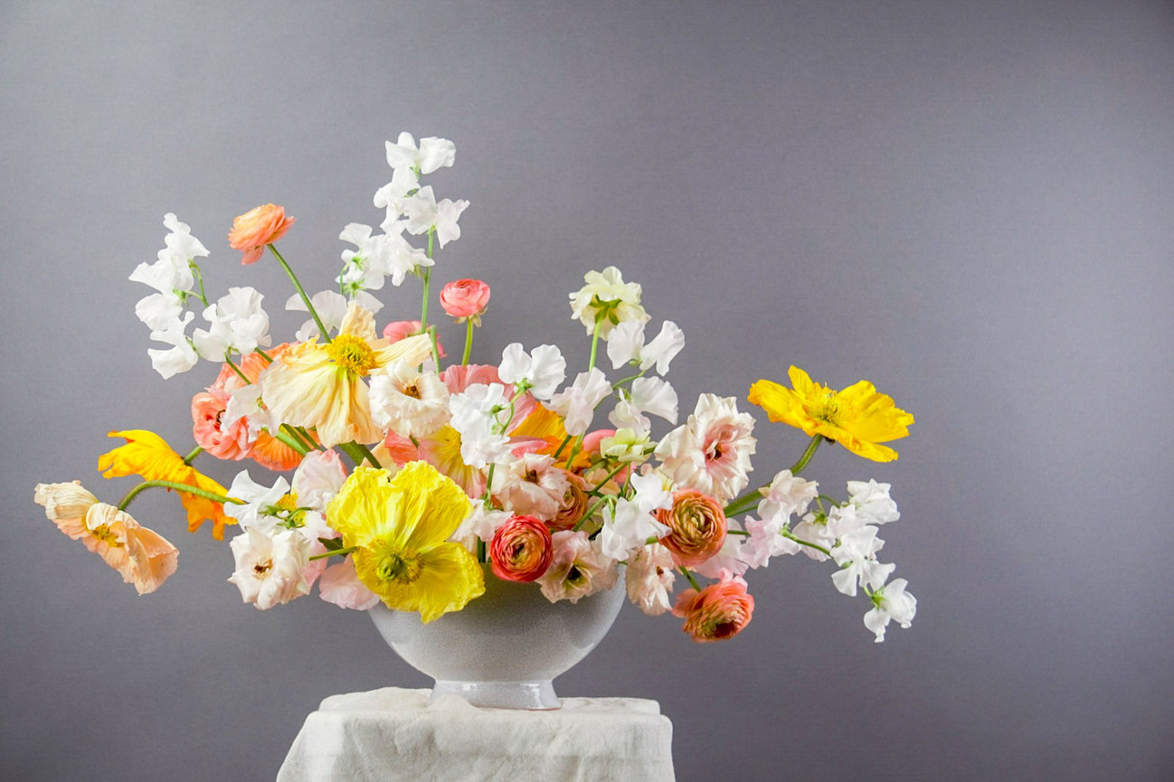 Bowl arrangement displaying a fun and modern game of texture and movement in bright peach and Yellow hues