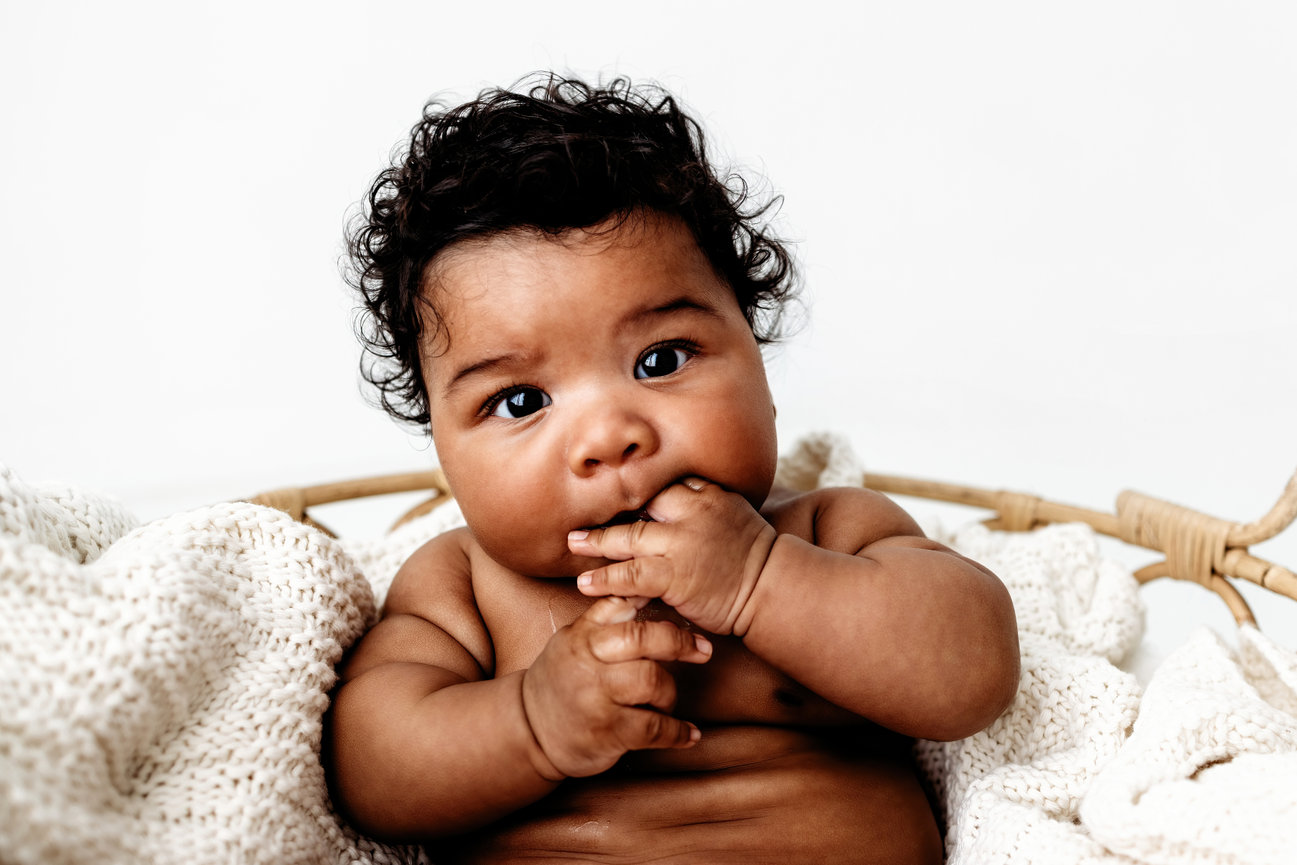 Orange County child photography baby portrait with soft natural lighting and neutral tones