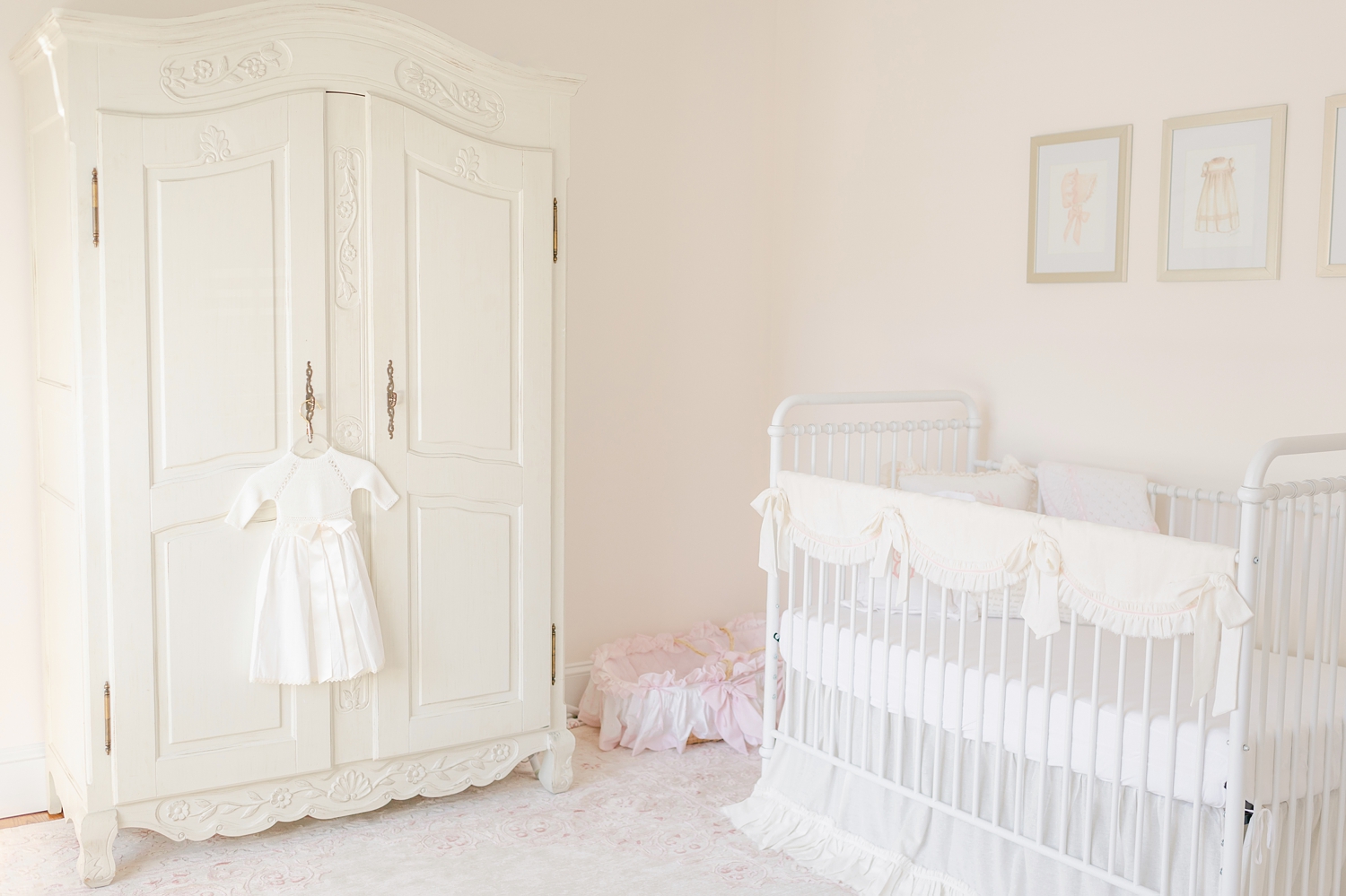 baby girl white nursery with pink details