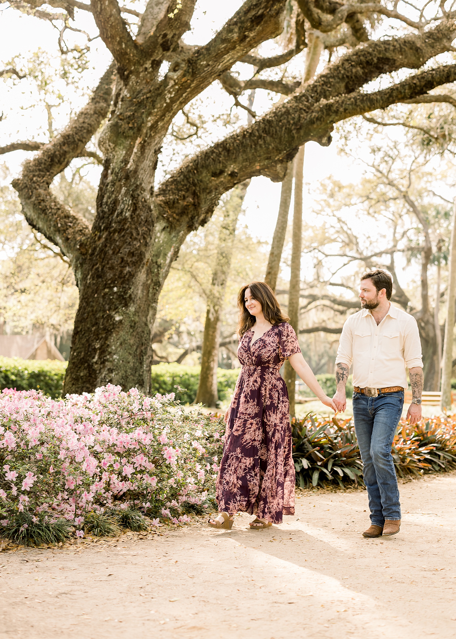 woman and man walking in the gardens in the spring at Washington Oaks State Park