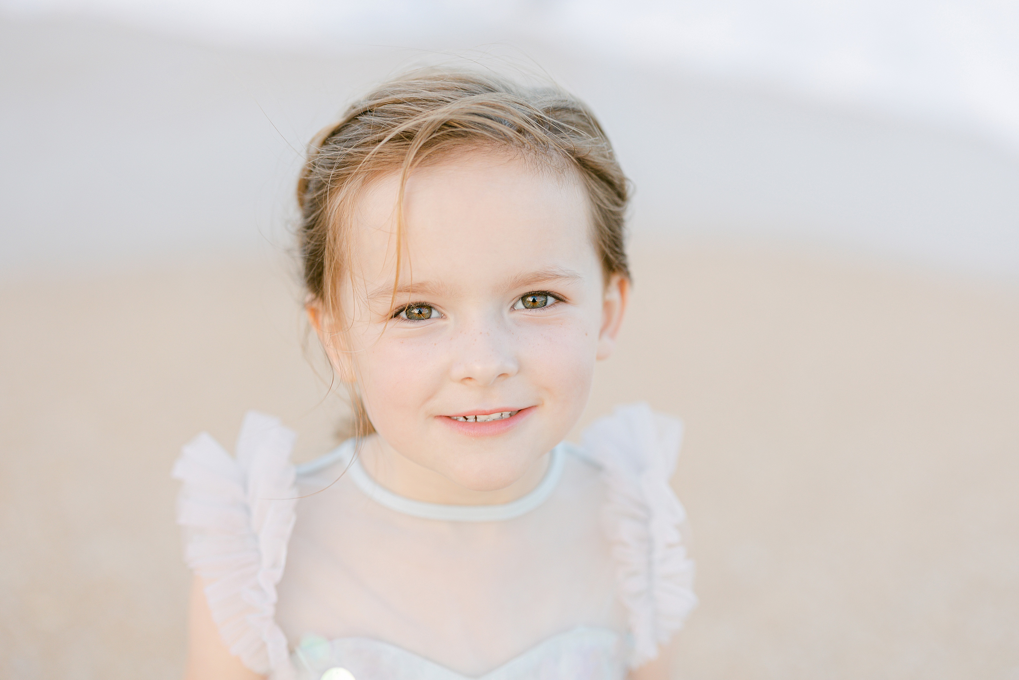 little girl with hazel eyes looking at the camera