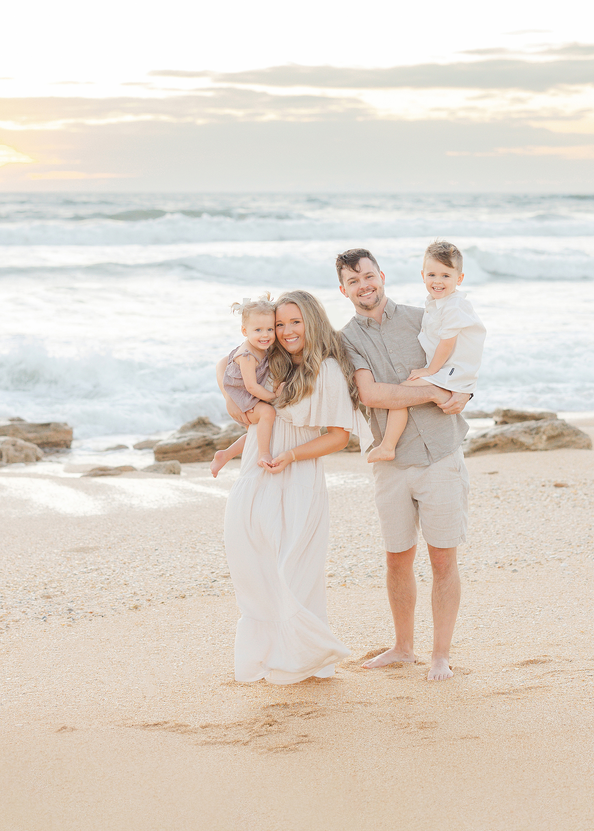 Colorful family beach portrait at sunrise in St. Augustine.
