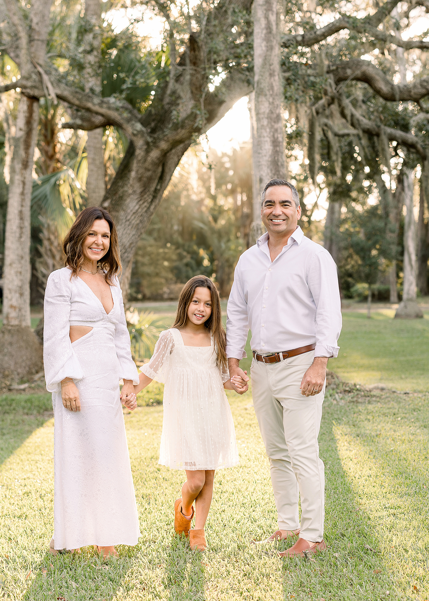 A light and airy family portrait of a family of three in Atlantic Beach at Johansen Park.