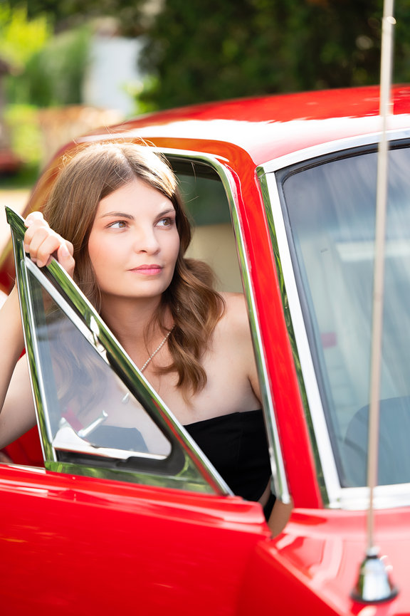 senior girl getting out of red mustang La crosse wisconsin