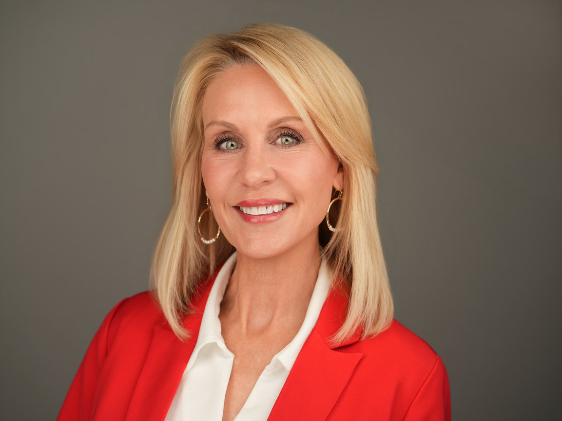 Executive-style professional headshot with studio lighting used for LinkedIn and corporate branding