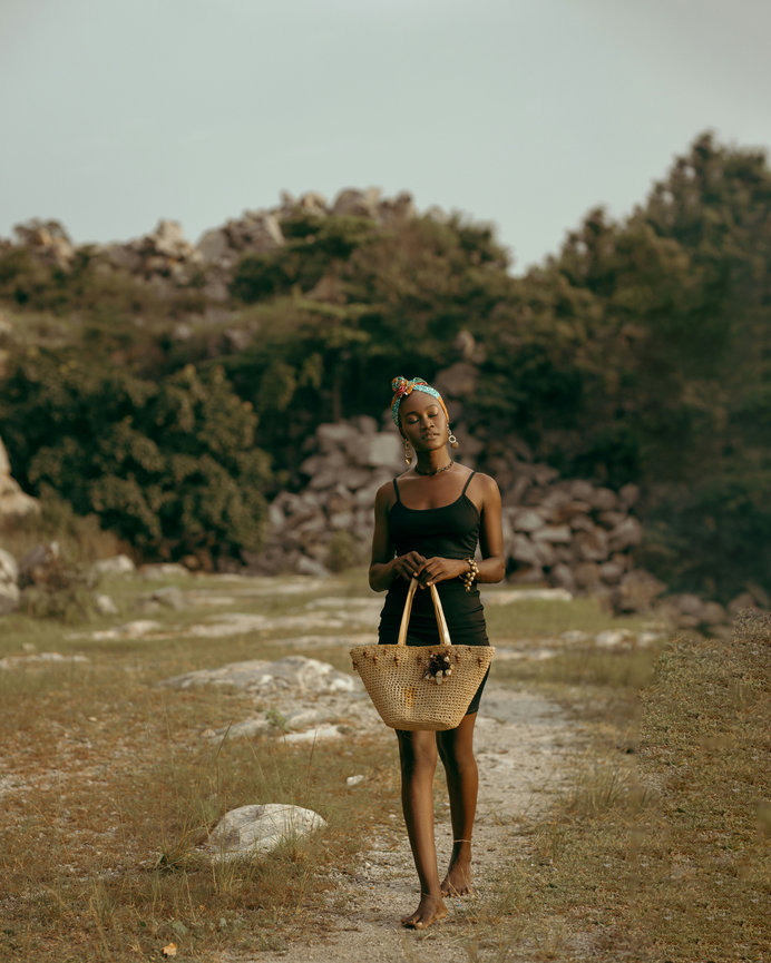 Woman walking with basket outdoors