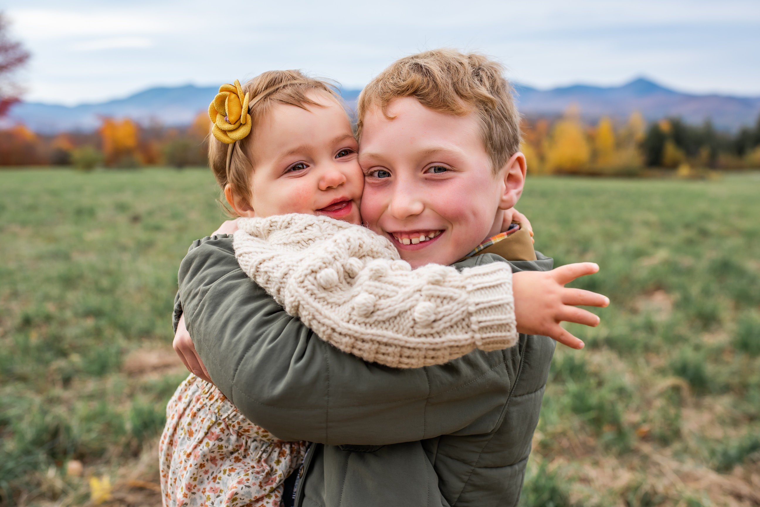 Brothers hugging during a fall family session in Vermont