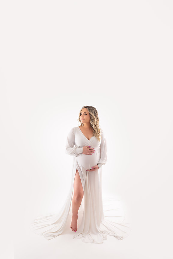 Natural light maternity portrait in cream silk dress, photographed in Wall Township studio