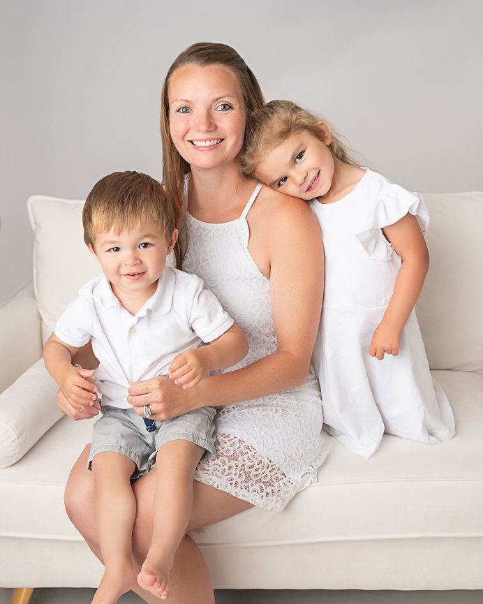Minimalist family photo on white set in Middletown studio