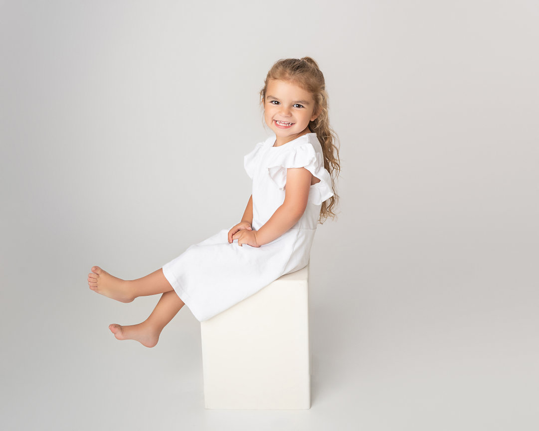 Three-year-old posing confidently in Holmdel studio session