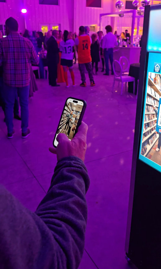 guest receiving AI-generated image instantly on phone with QR code sharing