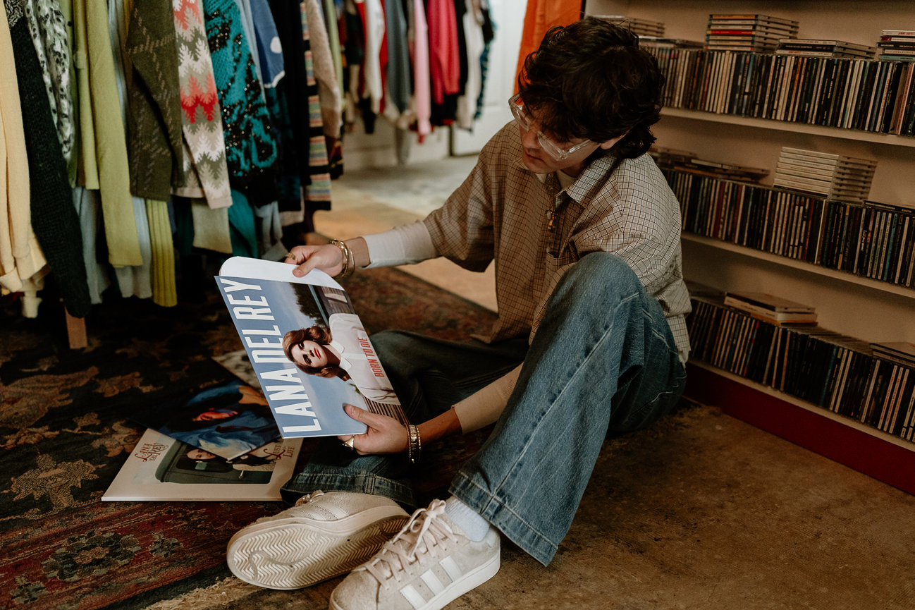 Person browsing records in a shop