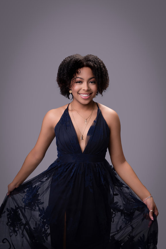 Portrait of a female in a navy dress