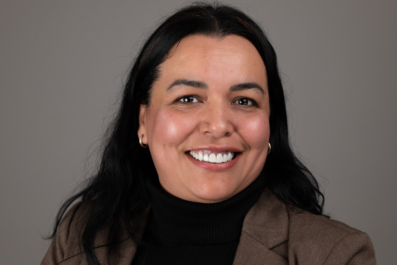 Smiling woman in dark jacket