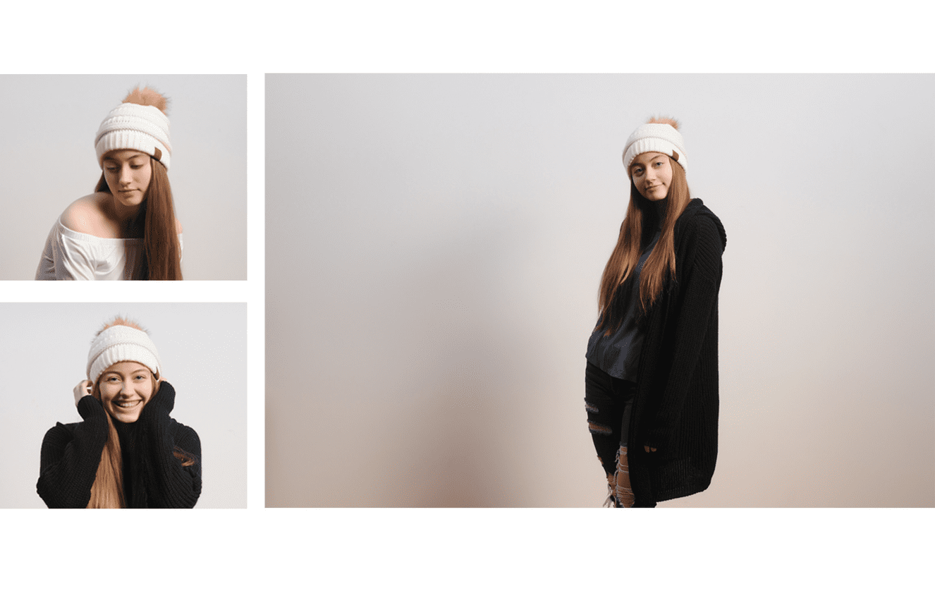 A teenage Icelandic girl posing like a model in her wool white had and coat at Kliks Photography in Cedar Rapids, Iowa.