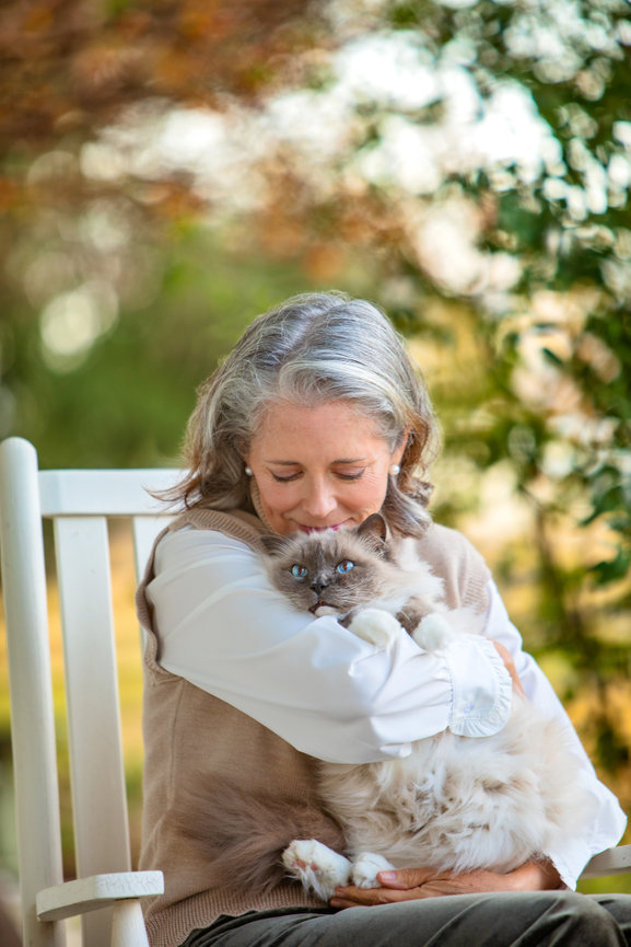 Cat portrait with her mom on the family's front porch.