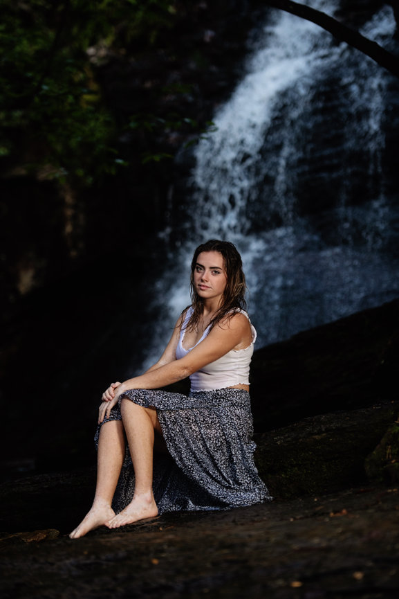 Beautiful woman model posing under waterfall wearing white swimwear Stock  Photo | Adobe Stock