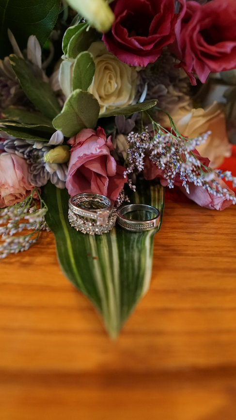 Close-up of wedding bouquet with decorative rings